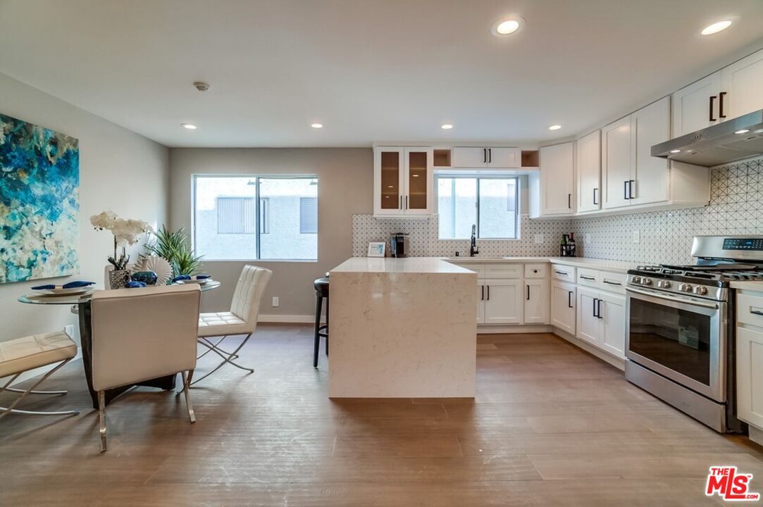 Dining room, Interior, Kitchen, Recessed Lighting, Stainless Steel Appliances, Wood Texture Flooring