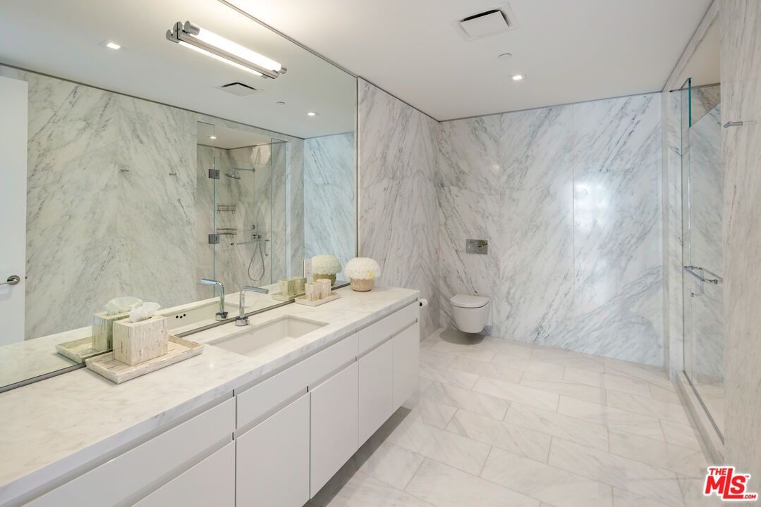 Bathroom, Dual Sink Vanities, Glass Shower, Interior, Marble, Marble Walls, Recessed Lighting