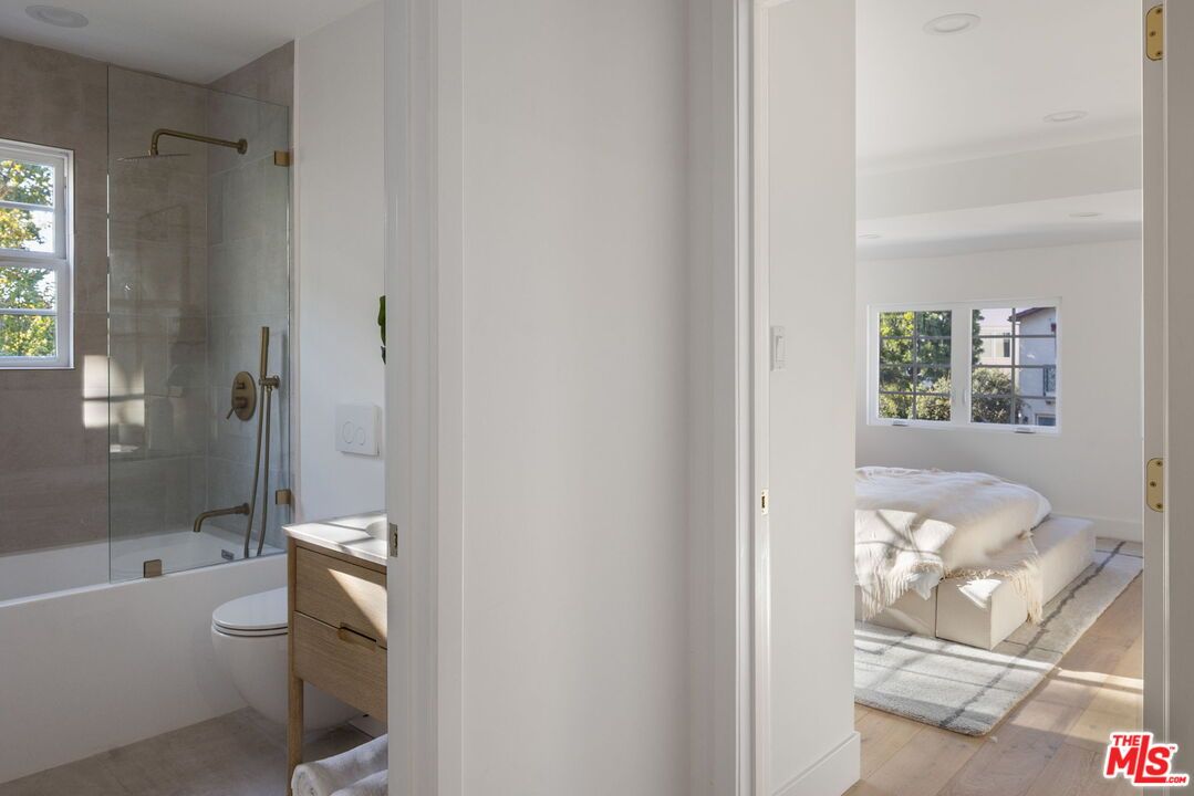 Bathroom, Bedroom, Glass Shower, Interior, Recessed Lighting, Wood Texture Flooring