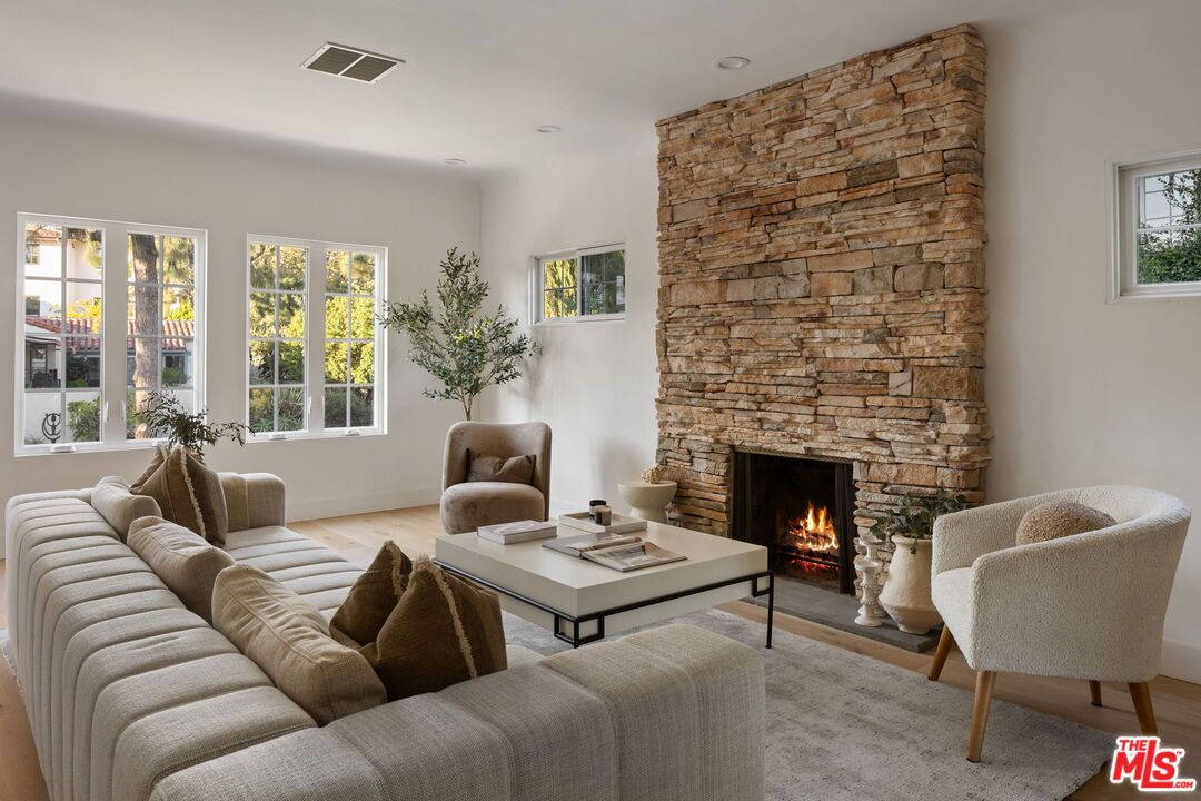 Fireplace, Interior, Living room, Recessed Lighting, Stone Walls, Wood Texture Flooring