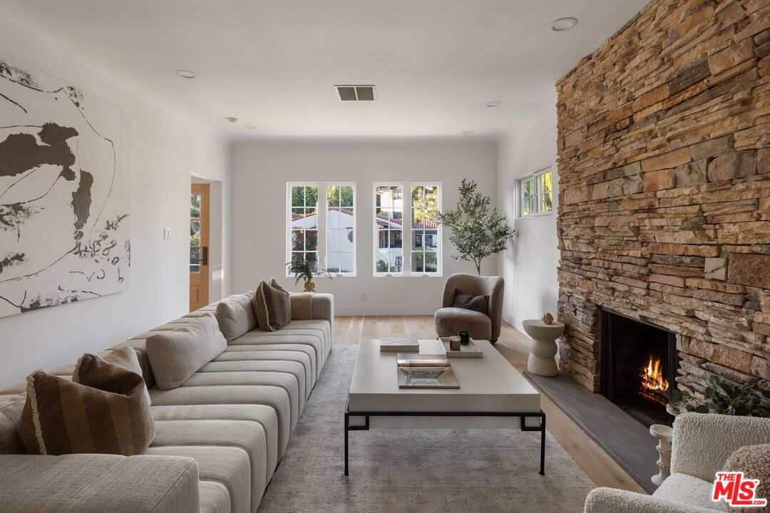 Fireplace, Interior, Living room, Recessed Lighting, Stone Walls, Wood Texture Flooring