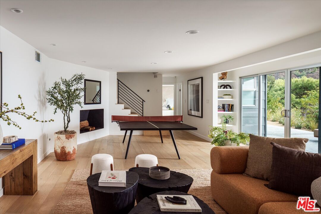 Fireplace, Game Room, Interior, Living room, Recessed Lighting, Wood Texture Flooring