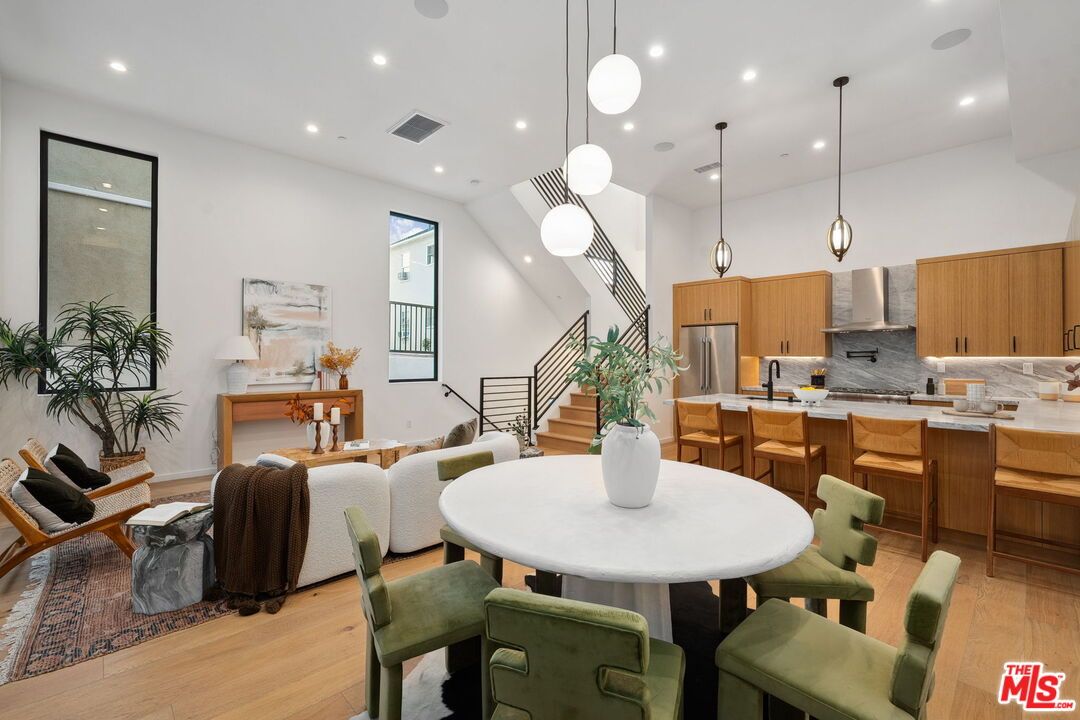 Dining room, Interior, Kitchen, Pendant Lights, Recessed Lighting, Stainless Steel Appliances, Wood Texture Flooring