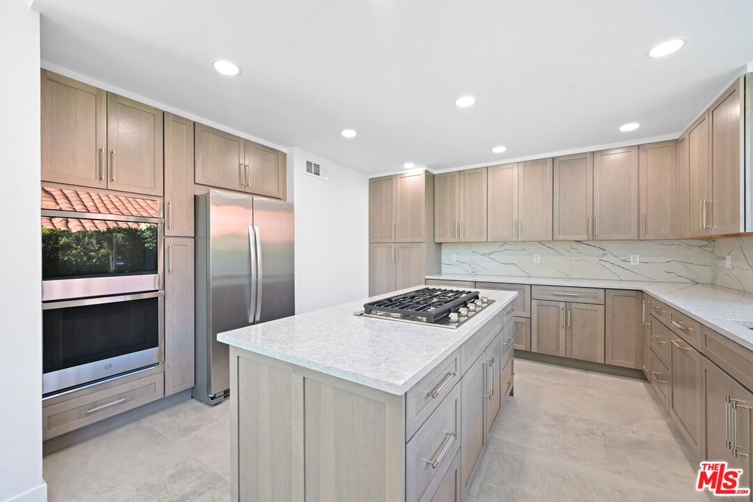 Interior, Kitchen, Marble Walls, Recessed Lighting, Stainless Steel Appliances