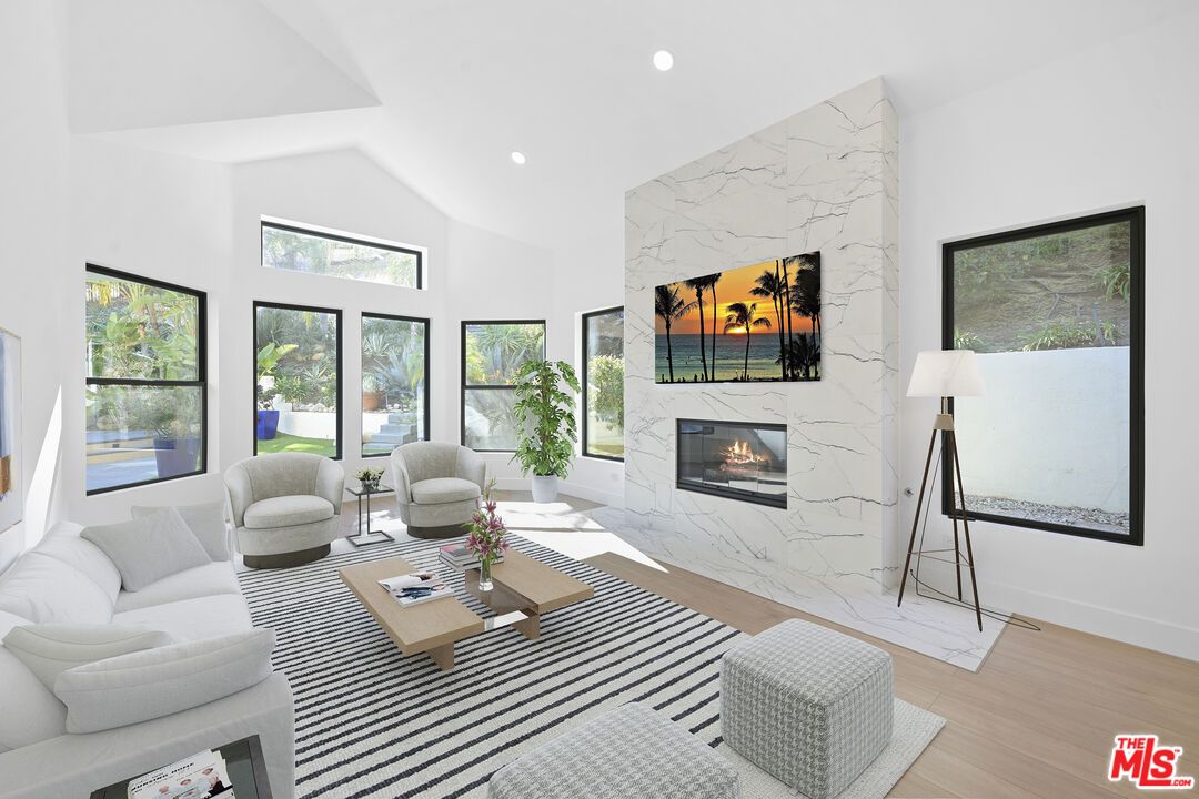 Fireplace, Interior, Living room, Marble Walls, Recessed Lighting, Wood Texture Flooring