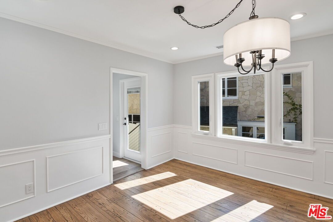 Chandelier, Empty room, Fireplace, Interior, Recessed Lighting, Stone Walls, Wood Texture Flooring