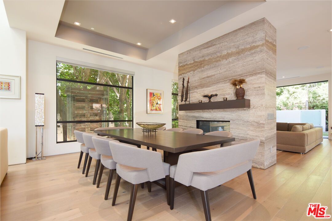 Dining room, Fireplace, Interior, Recessed Lighting, Stone Walls, Wood Texture Flooring