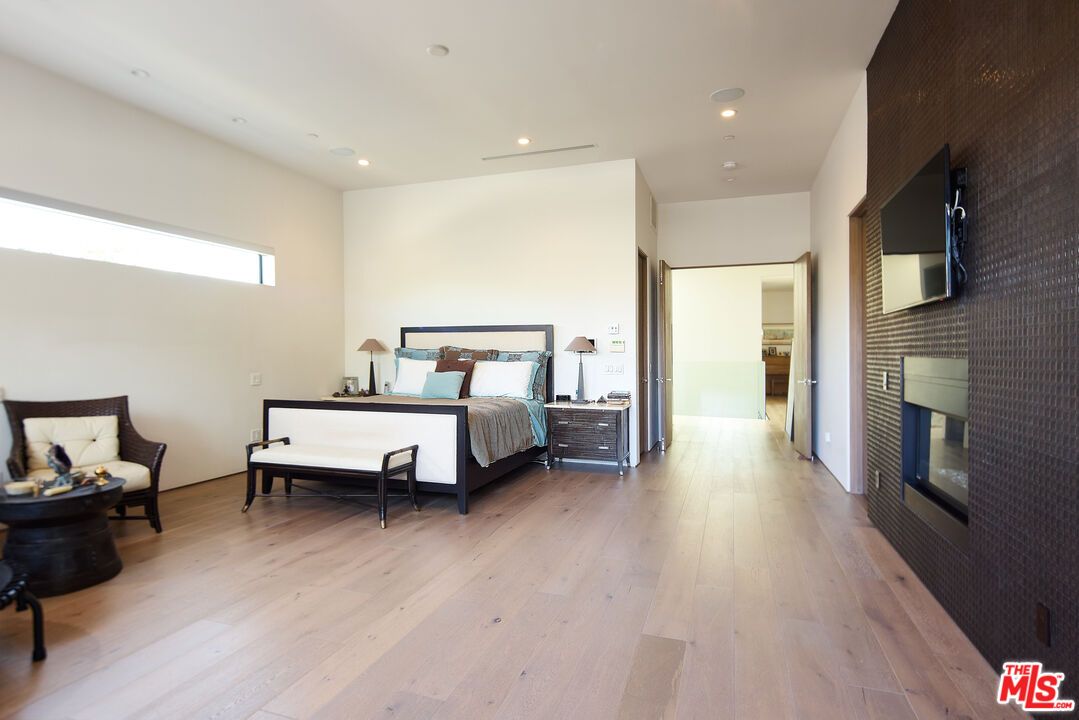 Bedroom, Fireplace, Interior, Recessed Lighting, Wood Texture Flooring