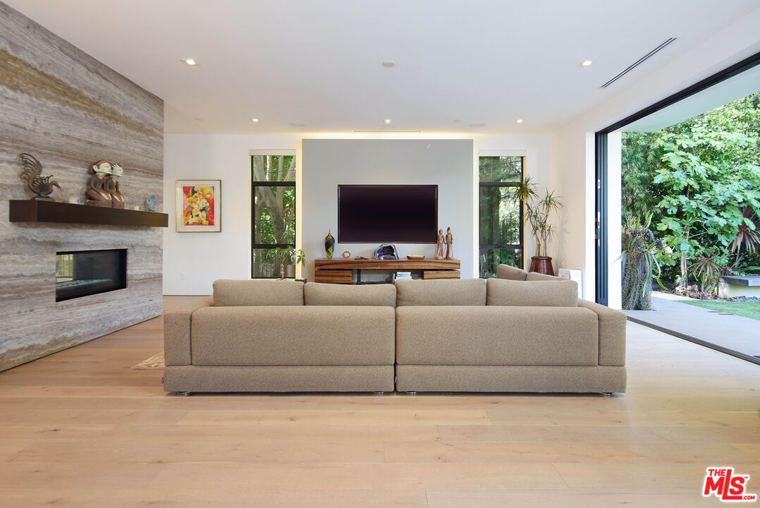 Fireplace, Interior, Living room, Recessed Lighting, Stone Walls, Wood Texture Flooring