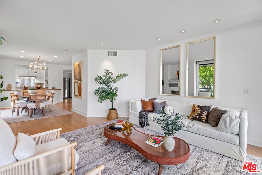 Chandelier, Dining room, Interior, Kitchen, Living room, Pendant Lights, Recessed Lighting, Stainless Steel Appliances, Wood Texture Flooring