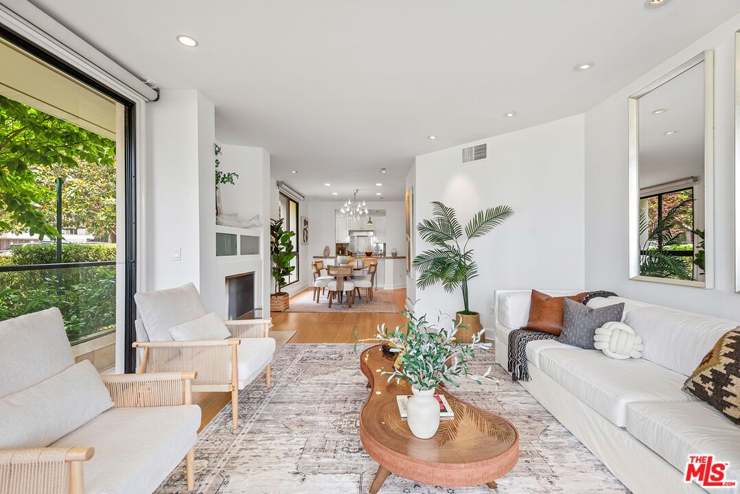 Chandelier, Dining room, Fireplace, Interior, Living room, Recessed Lighting, Wood Texture Flooring