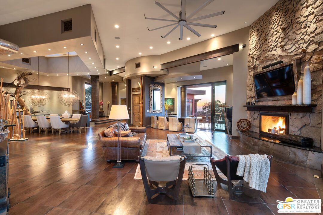 Chandelier, Dining room, Fireplace, Interior, Living room, Pendant Lights, Recessed Lighting, Stone Walls, Wood Texture Flooring