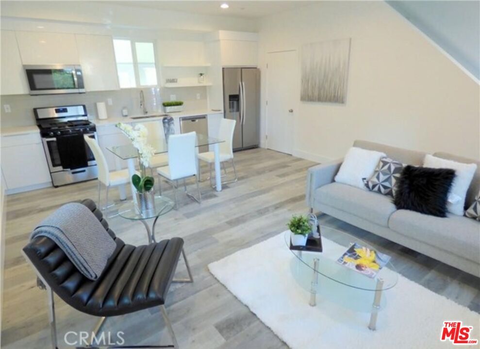 Dining room, Interior, Kitchen, Living room, Recessed Lighting, Stainless Steel Appliances, Wood Texture Flooring