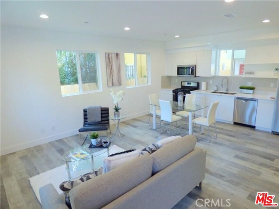 Dining room, Interior, Kitchen, Living room, Recessed Lighting, Stainless Steel Appliances, Wood Texture Flooring