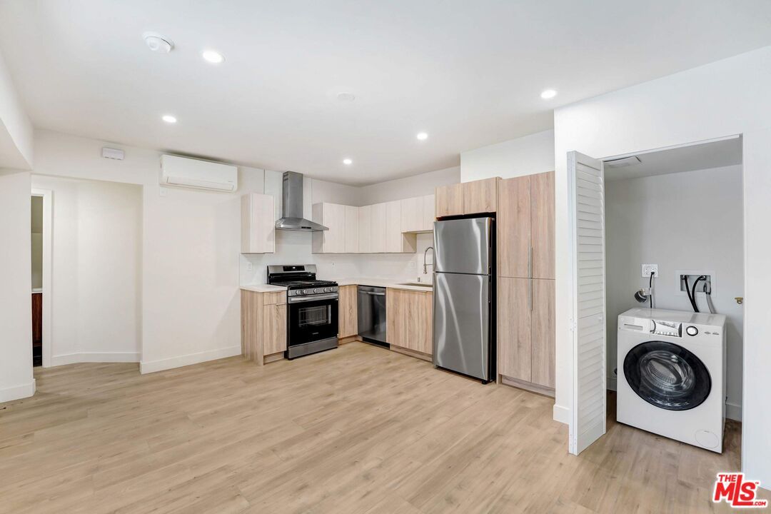 Interior, Kitchen, Recessed Lighting, Stainless Steel Appliances, Washer, Wood Texture Flooring