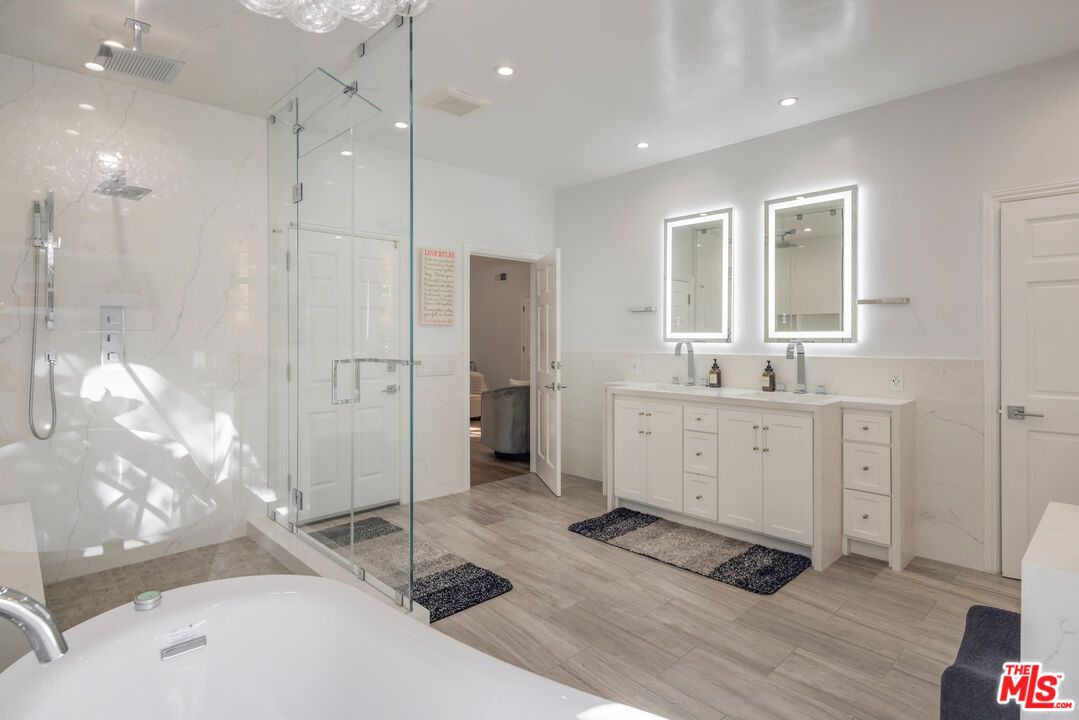 Bathroom, Dual Sink Vanities, Glass Shower, Interior, Marble Walls, Recessed Lighting, Wood Texture Flooring