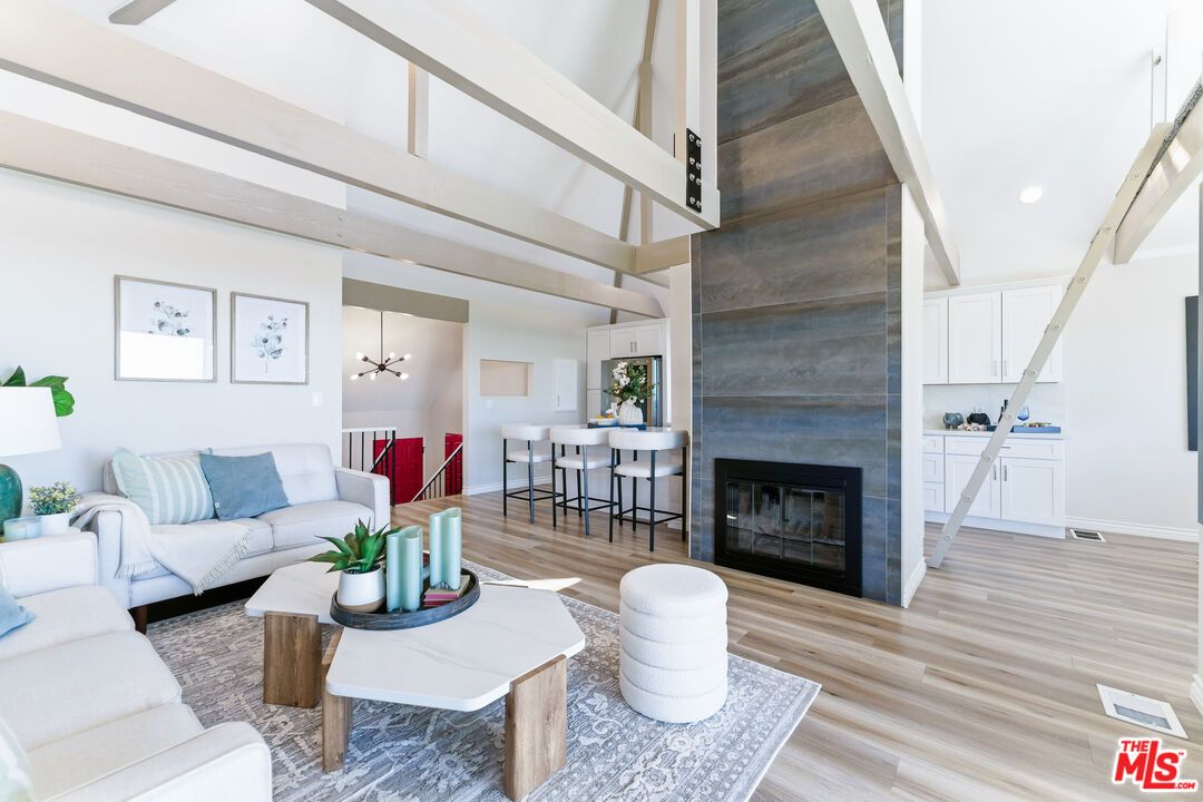 Dining room, Fireplace, Interior, Living room, Pendant Lights, Recessed Lighting, Wood Texture Flooring