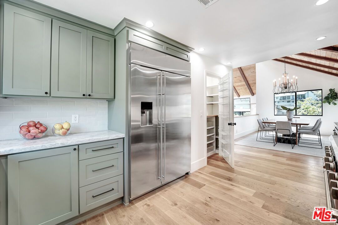 Chandelier, Dining room, Interior, Kitchen, Pendant Lights, Recessed Lighting, Stainless Steel Appliances, Wooden Ceilings, Wood Texture Flooring