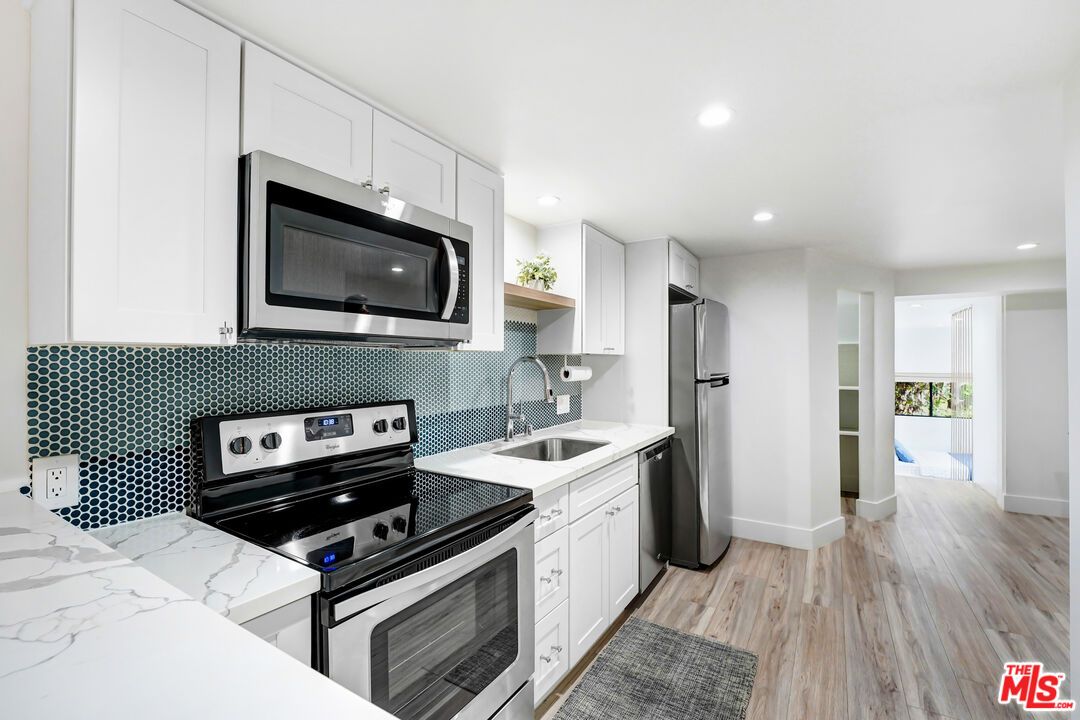 Interior, Kitchen, Recessed Lighting, Stainless Steel Appliances, Wood Texture Flooring