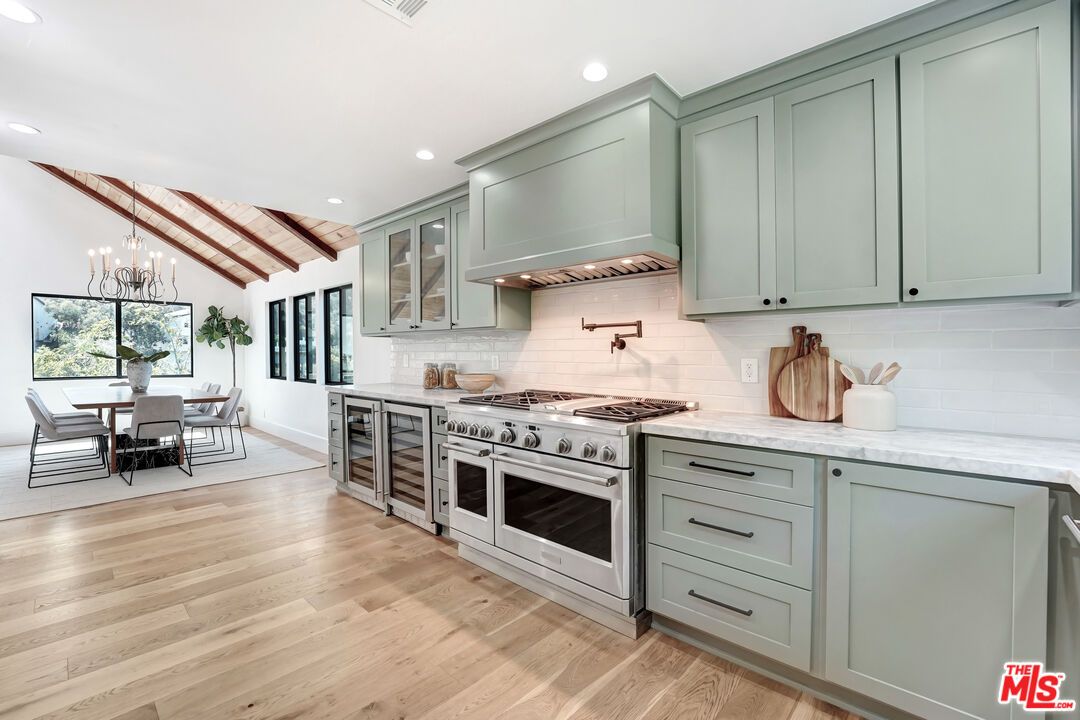 Chandelier, Dining room, Interior, Kitchen, Pendant Lights, Recessed Lighting, Stainless Steel Appliances, Wooden Beams, Wood Texture Flooring