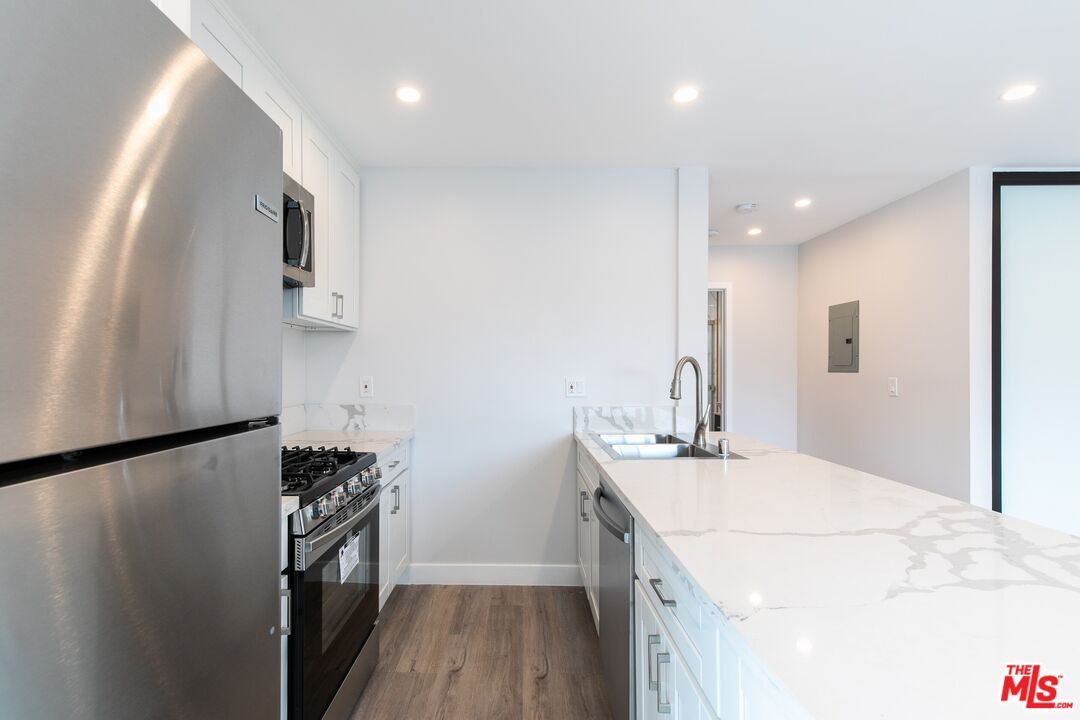 Interior, Kitchen, Recessed Lighting, Stainless Steel Appliances, Wood Texture Flooring