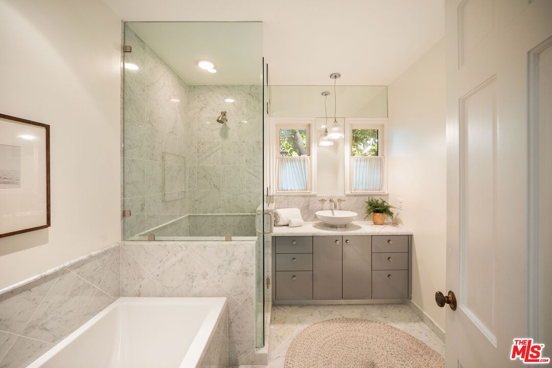 Bathroom, Dual Sink Vanities, Glass Shower, Interior, Marble Walls, Pendant Lights, Recessed Lighting