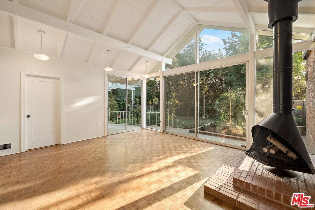 Fireplace, Interior, Pendant Lights, Sun Room, Wood Texture Flooring