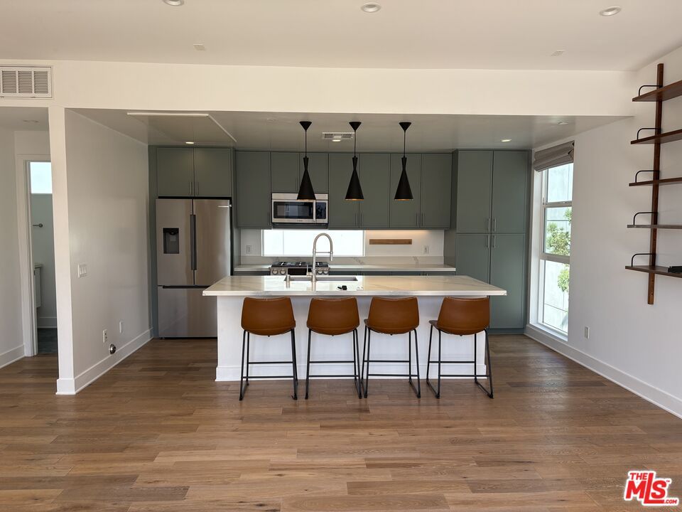 Interior, Kitchen, Pendant Lights, Recessed Lighting, Stainless Steel Appliances, Wood Texture Flooring