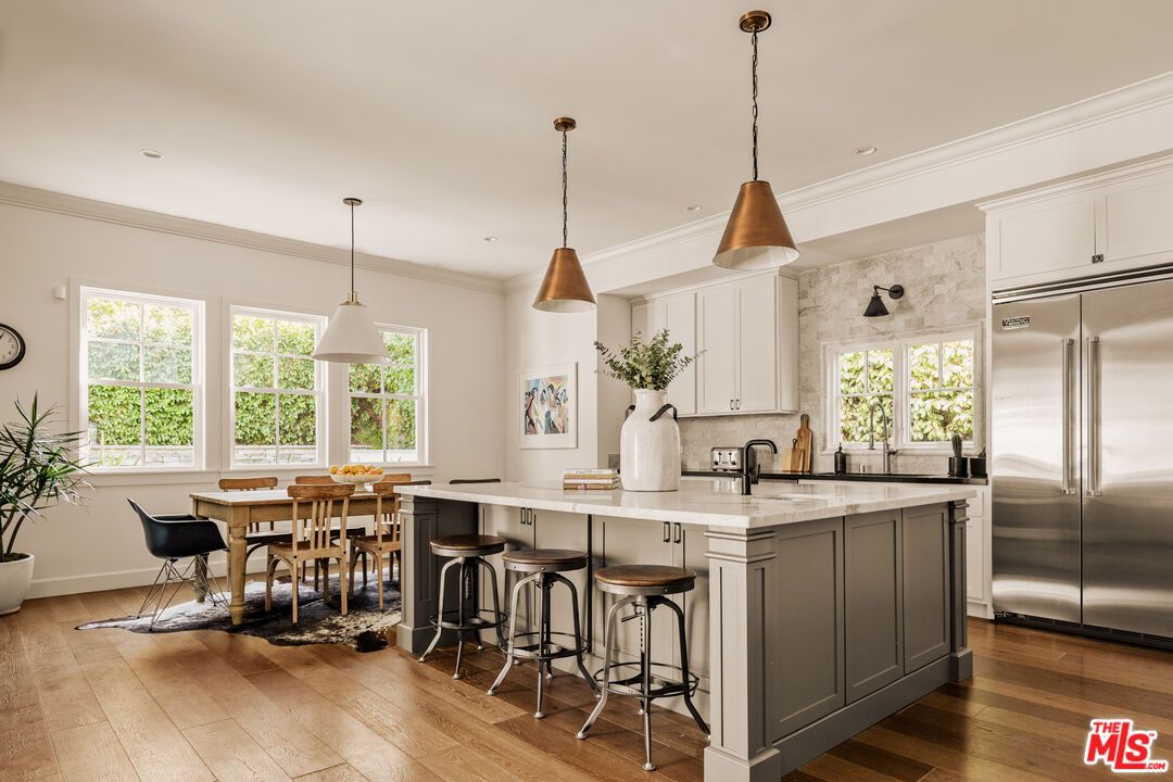 Dining room, Interior, Kitchen, Pendant Lights, Recessed Lighting, Stainless Steel Appliances, Wood Texture Flooring