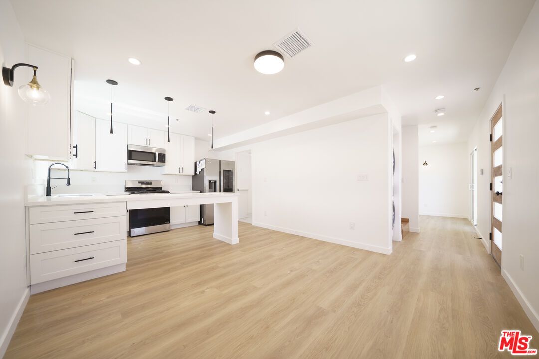 Interior, Kitchen, Pendant Lights, Recessed Lighting, Stainless Steel Appliances, Wood Texture Flooring
