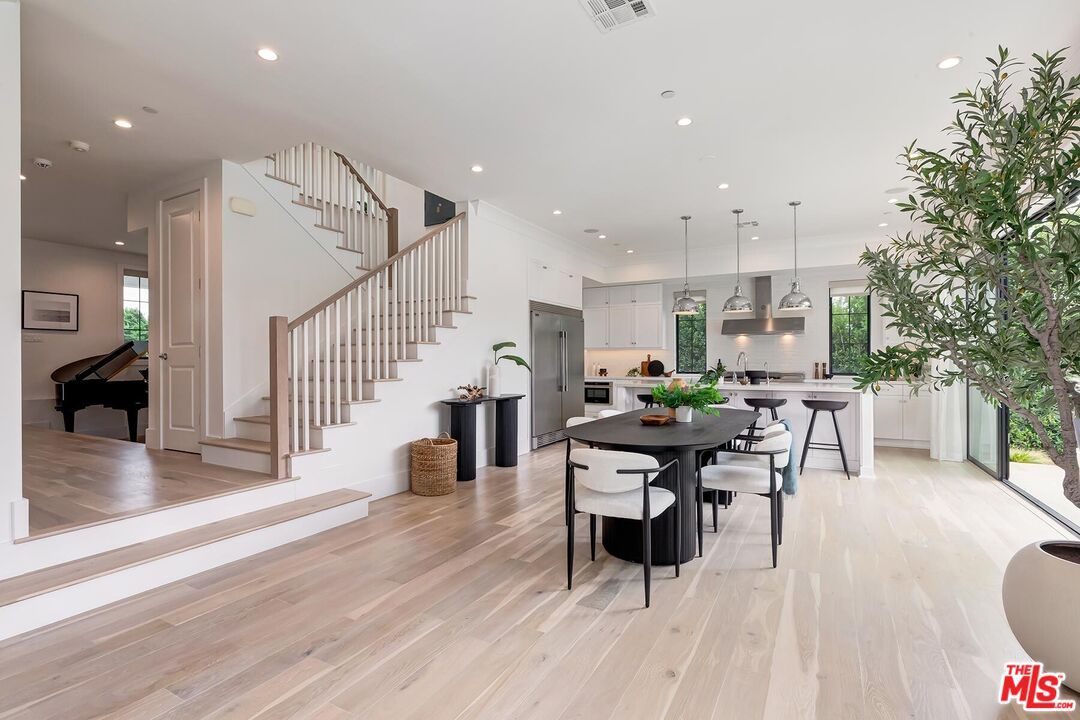 Dining room, Interior, Kitchen, Pendant Lights, Recessed Lighting, Stainless Steel Appliances, Wood Texture Flooring