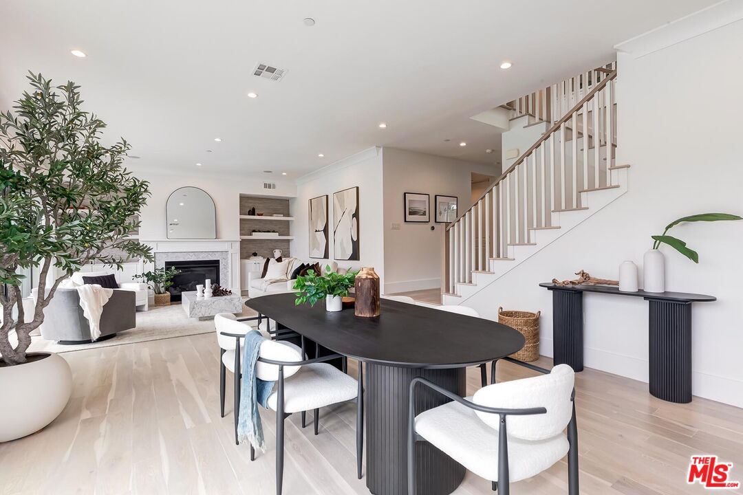 Dining room, Fireplace, Interior, Living room, Recessed Lighting, Wood Texture Flooring