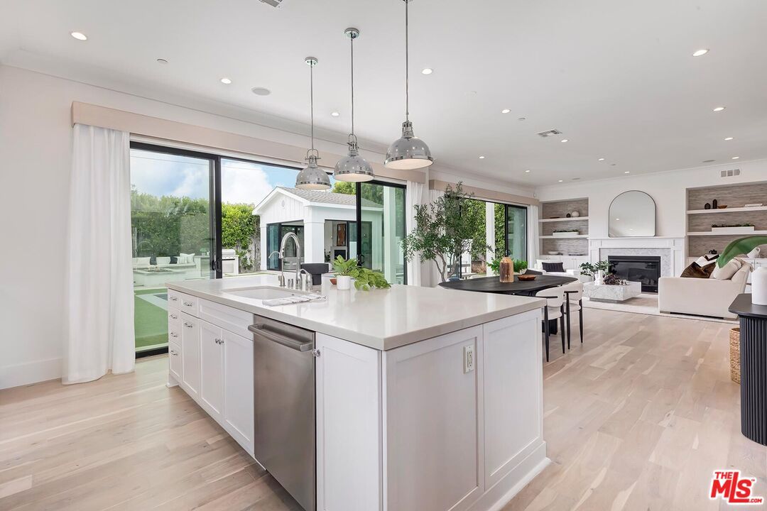 Dining room, Fireplace, Interior, Kitchen, Living room, Pendant Lights, Recessed Lighting, Stainless Steel Appliances, Wood Texture Flooring