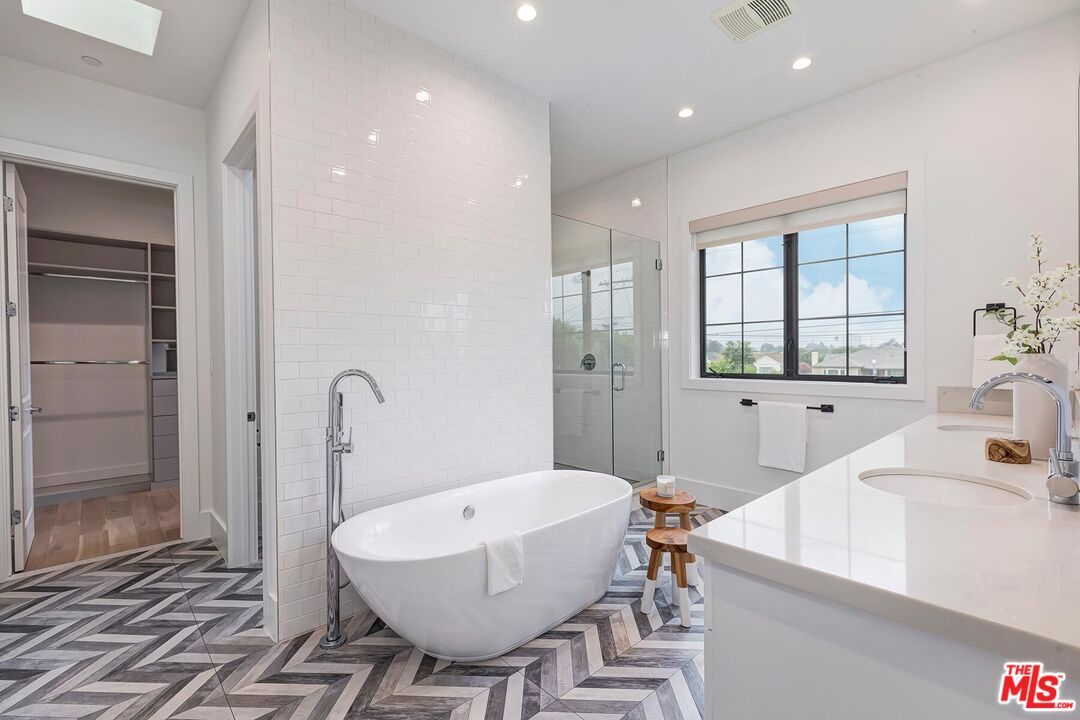 Bathroom, Dual Sink Vanities, Free Standing Baths, Glass Shower, Interior, Recessed Lighting, Walk-in Closets, Wood Texture Flooring