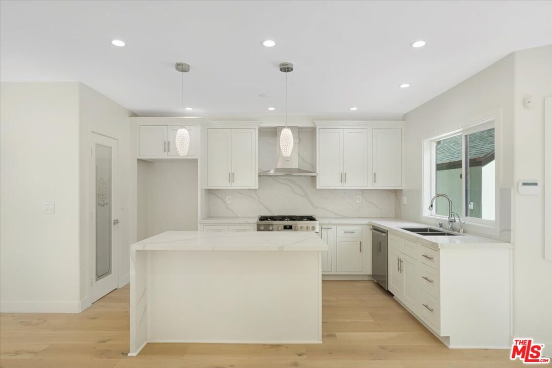 Interior, Kitchen, Marble Walls, Pendant Lights, Recessed Lighting, Wood Texture Flooring