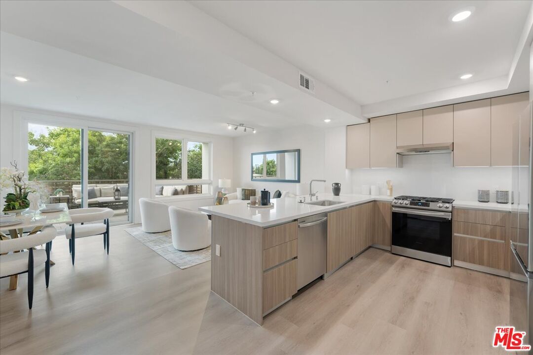 Dining room, Interior, Kitchen, Living room, Recessed Lighting, Stainless Steel Appliances, Wood Texture Flooring