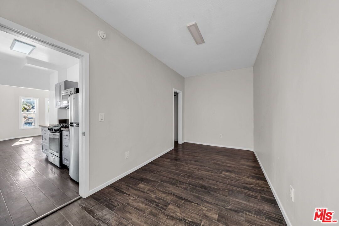 Empty room, Interior, Kitchen, Stainless Steel Appliances, Wood Texture Flooring