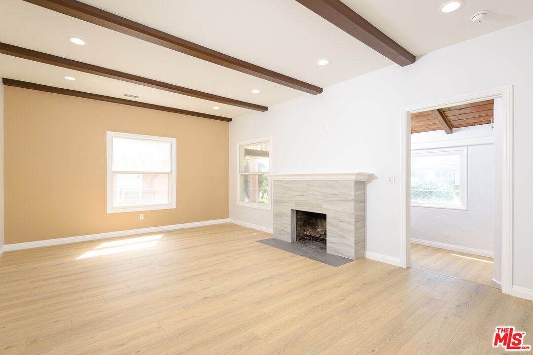 Empty room, Fireplace, Interior, Recessed Lighting, Wooden Beams, Wood Texture Flooring