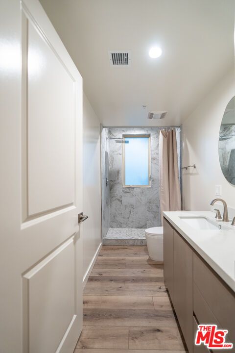 Bathroom, Glass Shower, Interior, Marble Walls, Recessed Lighting, Wood Texture Flooring