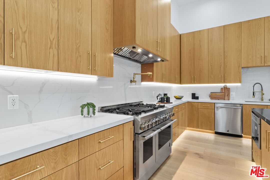 Interior, Kitchen, Marble Walls, Stainless Steel Appliances, Wood Texture Flooring