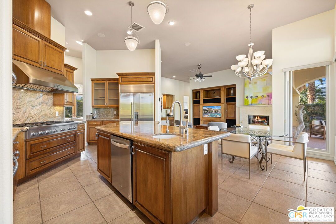 Chandelier, Fireplace, Interior, Kitchen, Living room, Pendant Lights, Recessed Lighting, Stainless Steel Appliances