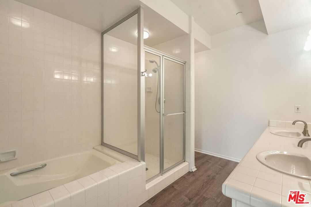 Bathroom, Dual Sink Vanities, Glass Shower, Interior, Tile Countertops, Wood Texture Flooring