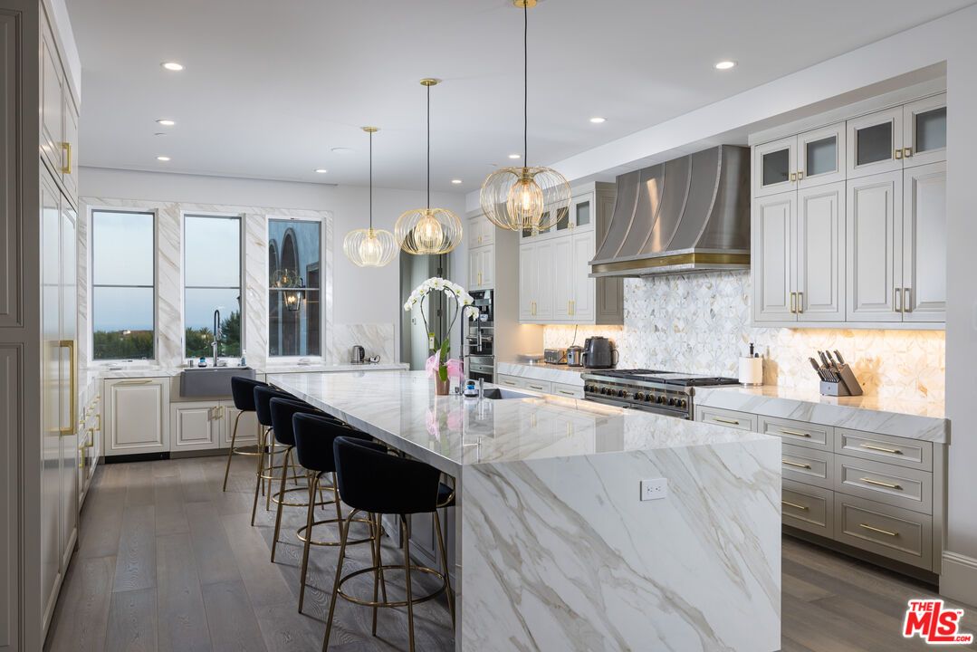 Interior, Kitchen, Marble Walls, Pendant Lights, Recessed Lighting, Stainless Steel Appliances, Wood Texture Flooring