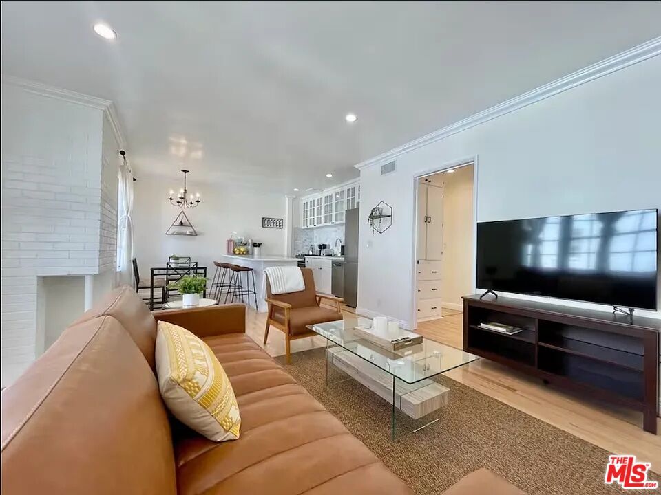 Dining room, Fireplace, Interior, Living room, Pendant Lights, Recessed Lighting, Stone Walls, Wood Texture Flooring