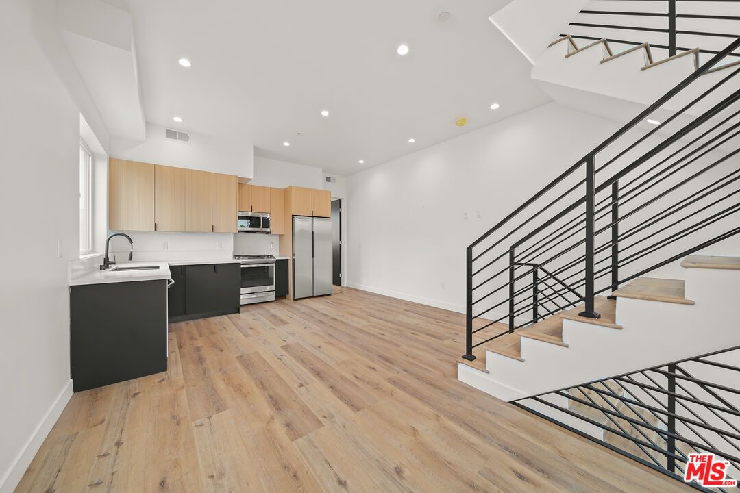 Interior, Kitchen, Recessed Lighting, Stainless Steel Appliances, Wood Texture Flooring