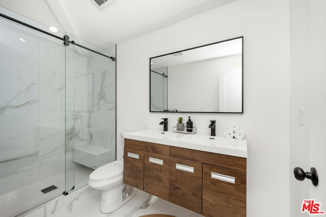 Bathroom, Dual Sink Vanities, Glass Shower, Interior, Marble, Marble Walls, Recessed Lighting