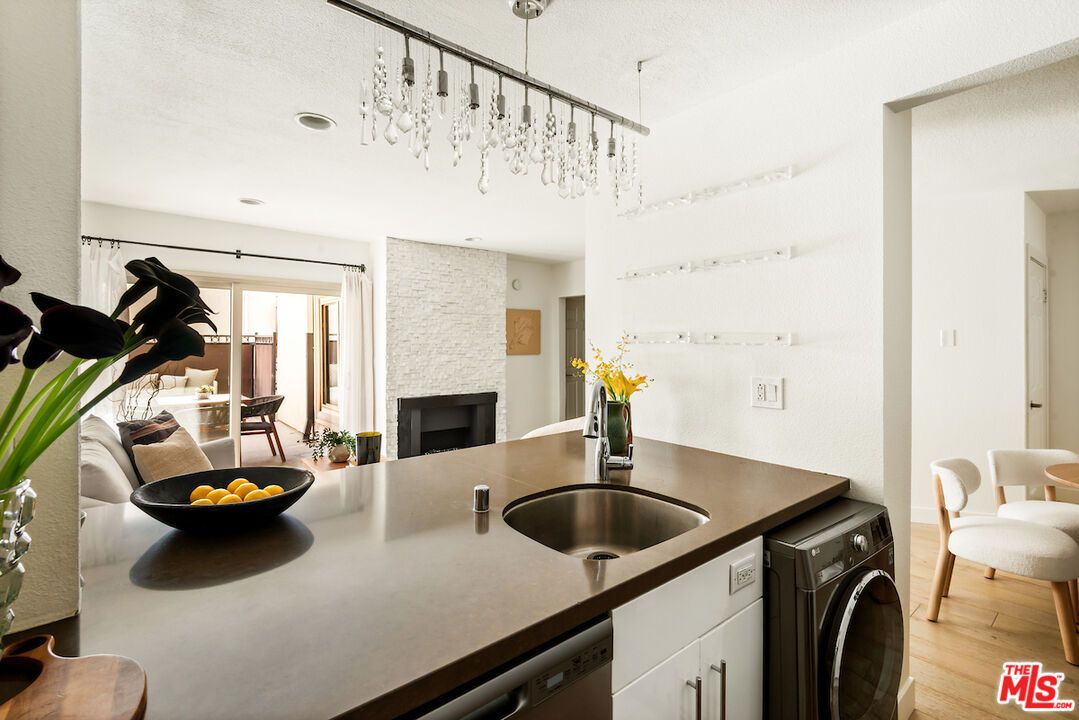 Fireplace, Interior, Recessed Lighting, Washer, Wood Texture Flooring