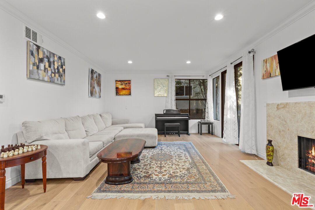 Fireplace, Interior, Living room, Piano, Recessed Lighting, Wood Texture Flooring