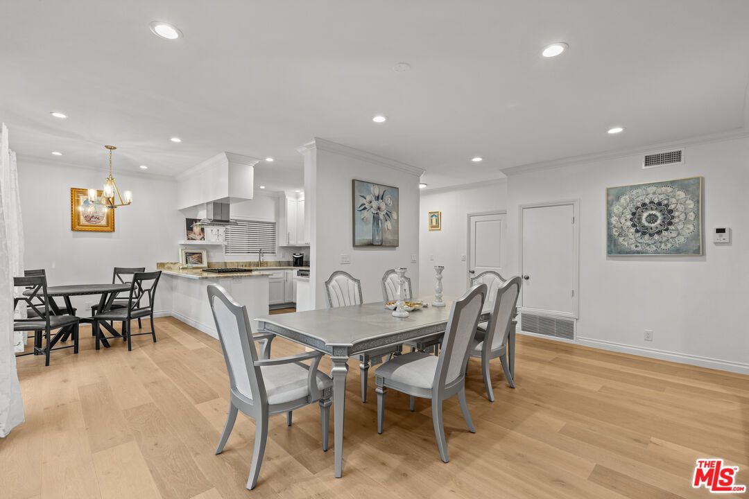 Chandelier, Dining room, Interior, Kitchen, Recessed Lighting, Stainless Steel Appliances, Wood Texture Flooring