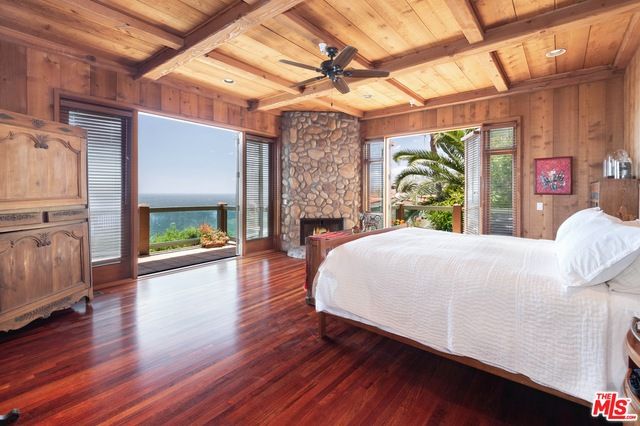 Bedroom, Fireplace, Interior, Recessed Lighting, Stone Walls, Water, Wooden Beams, Wooden Ceilings, Wood Texture Flooring, Wooden Walls